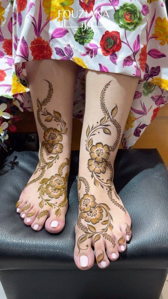 “Arabic style foot mehndi design with bold leaves and curved lines”