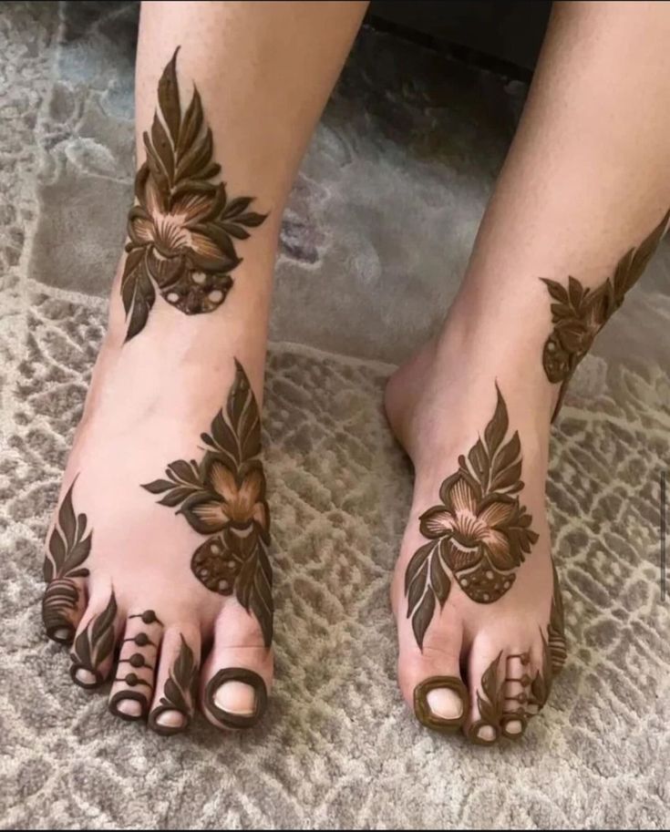 “Traditional Arabic henna design for feet with elegant curved patterns”