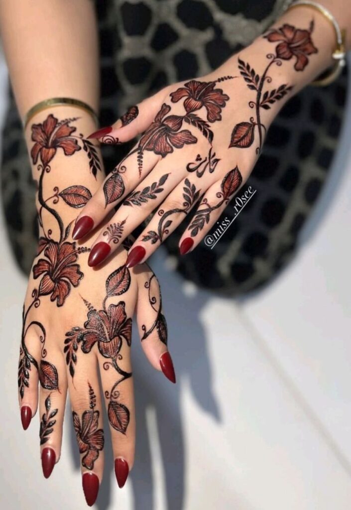 Stylish Arabic floral trail Eid ul Adha mehndi design 2026 with flowing vines and bold flower patterns on hand.
