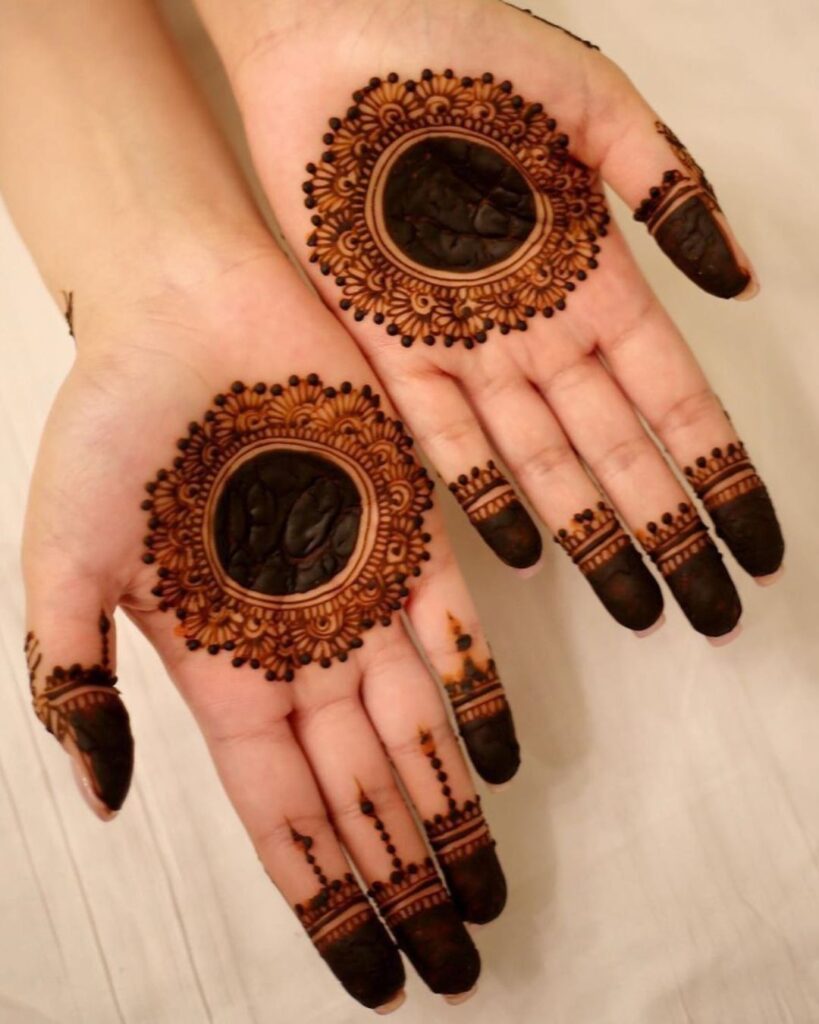 Circular palm bridal mehndi design with centered mandala pattern, clean symmetry, and elegant Simple Bridal Mehndi Designs 2026 style for modern brides