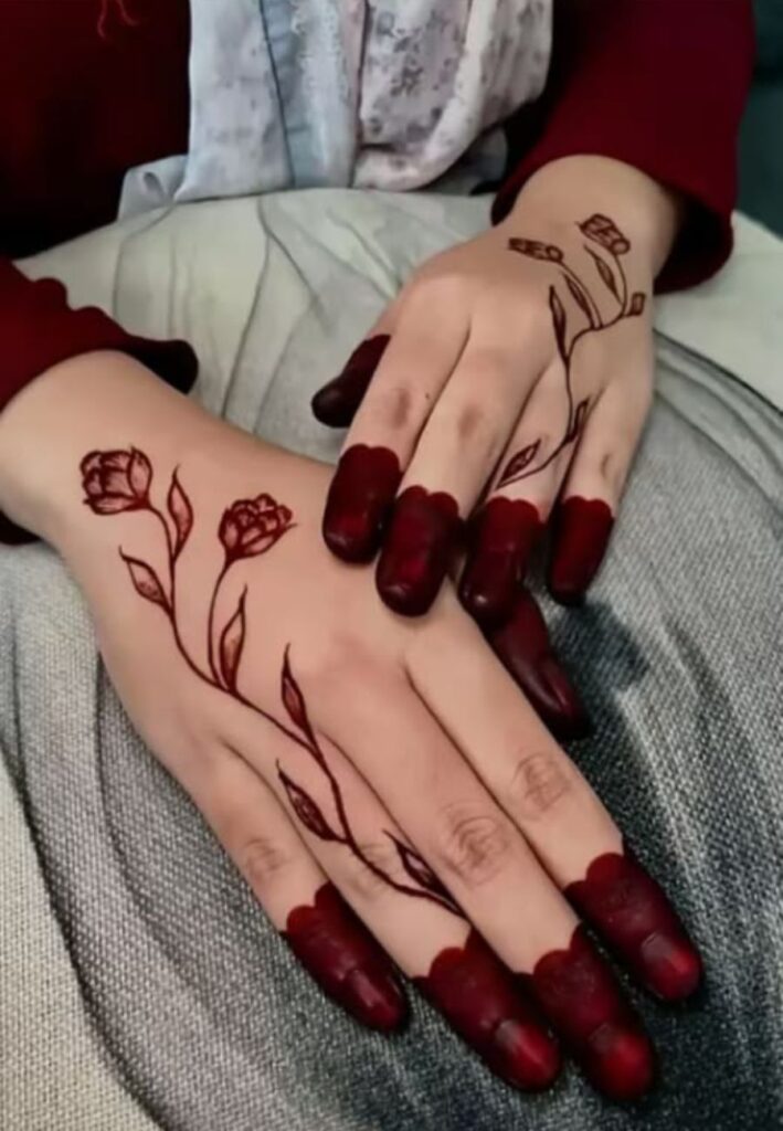 Finger tip bold mehndi pattern with dark filled fingertips and simple connecting lines