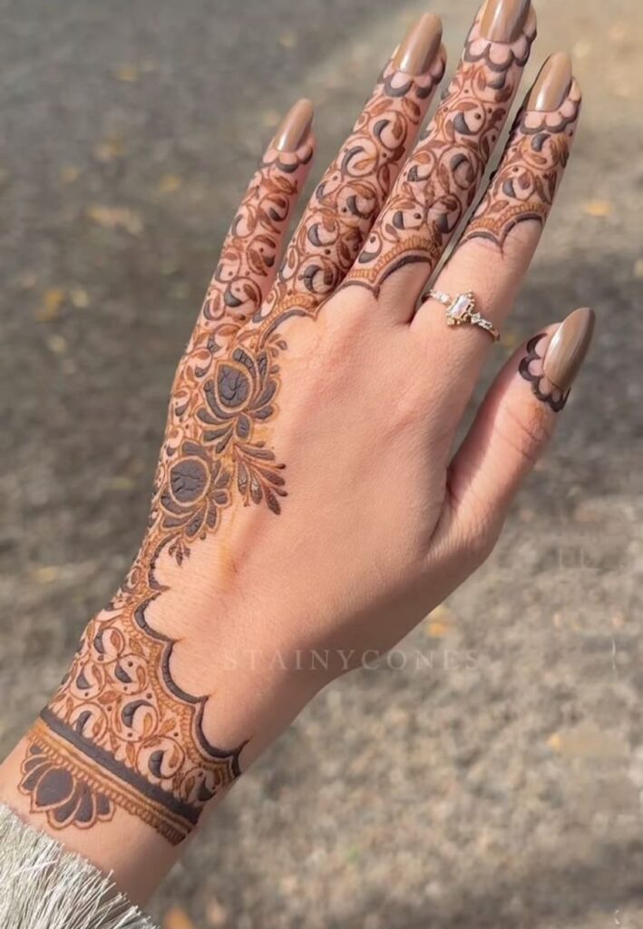 Half hand Arabic cascade mehndi design with flowing floral patterns for Eid 2026