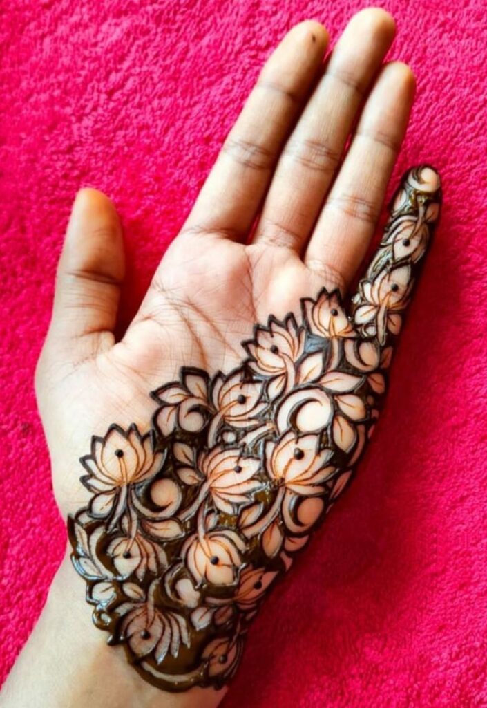 Half hand lotus mehndi design 2026 with floral fusion patterns and minimal negative space for trendy modern look