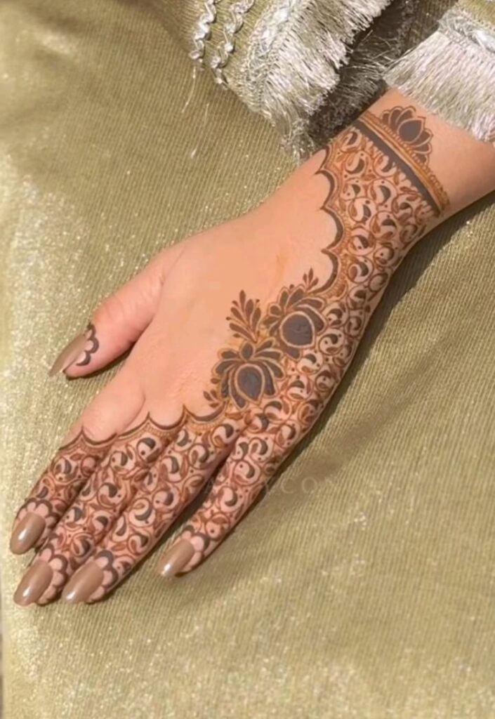 Trendy half-hand mehrab mehndi design with geometric arches, floral fillers, and balanced traditional styling