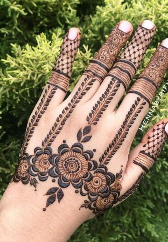 Hand harness bridal mehndi design with modern jewelry style henna artwork