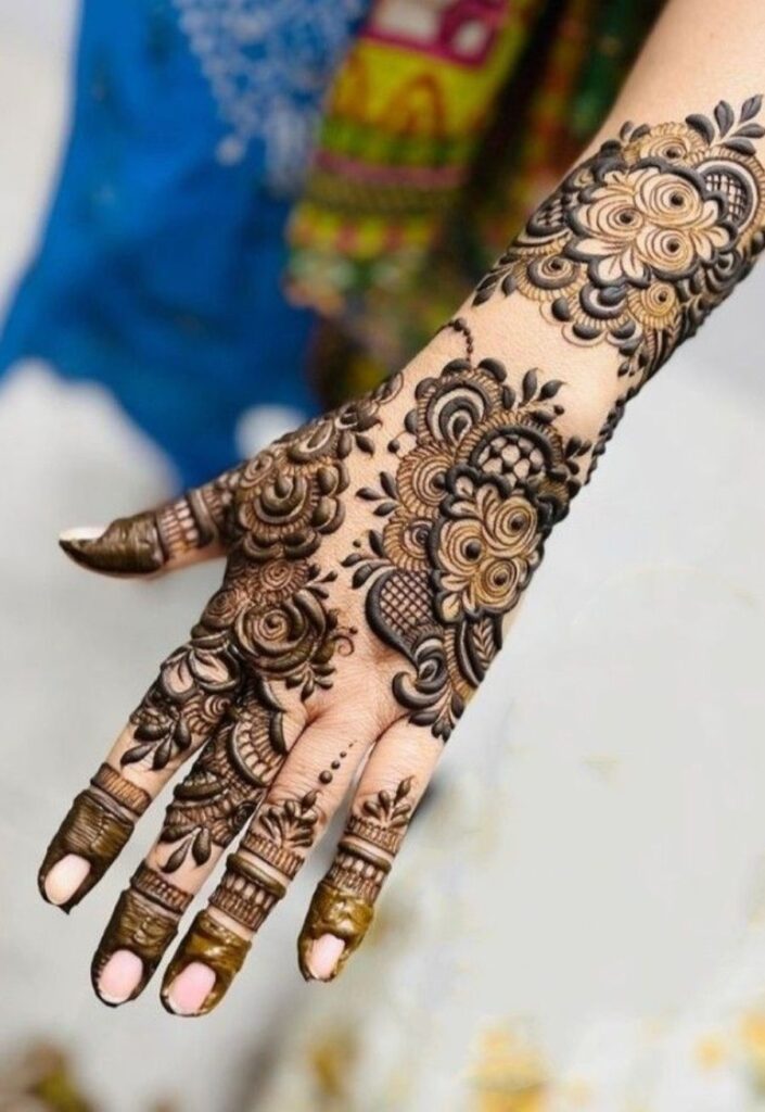 Elegant Indo-Arabic bridal mehndi design featuring a fusion of dense Indian motifs and flowing Arabic floral patterns, intricate full-hand henna detailing with balanced negative space, modern 2026 bridal aesthetic style.
