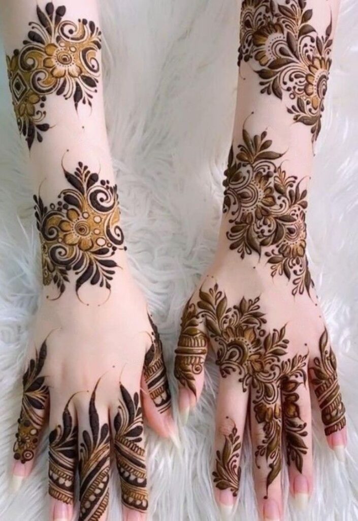 Intricate bridal Dubai Mehendi Design covering full hand with rich floral detailing.