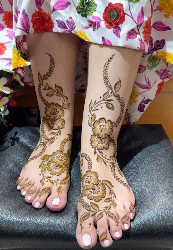 Minimalist Dubai Mehendi Design on feet with delicate ankle patterns.
