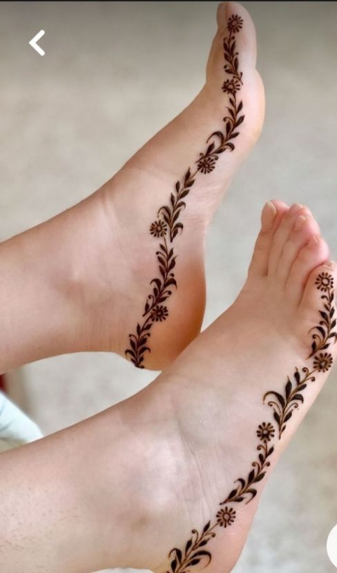 “Elegant minimal henna design for feet with light and subtle patterns”