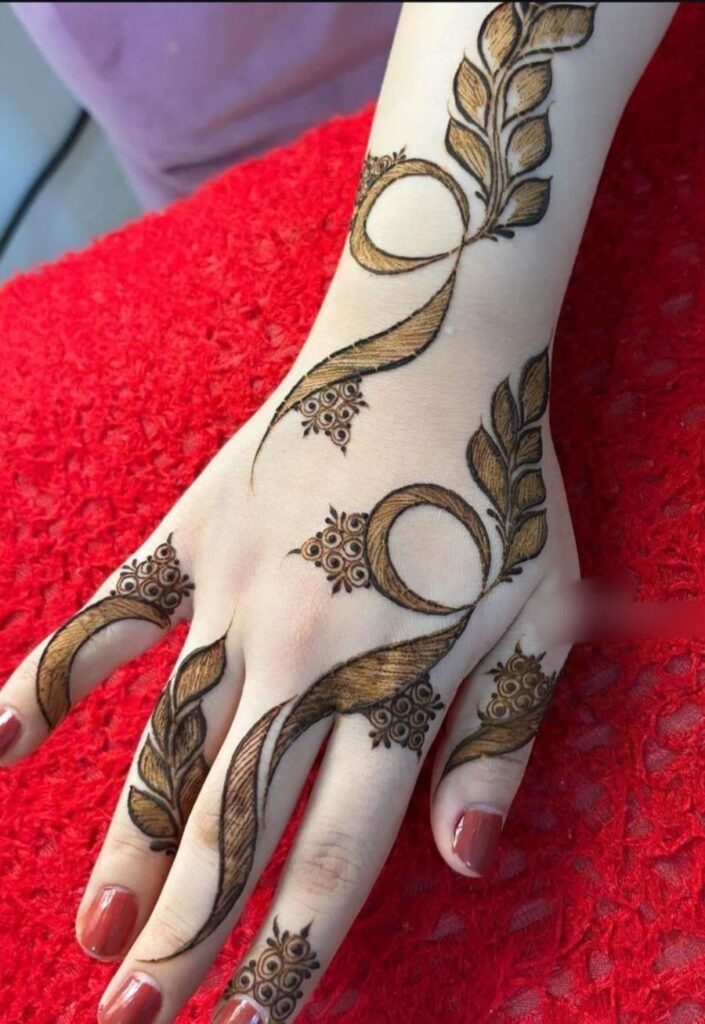 Gulf Style Mehendi for back hand with modern geometric floral patterns.