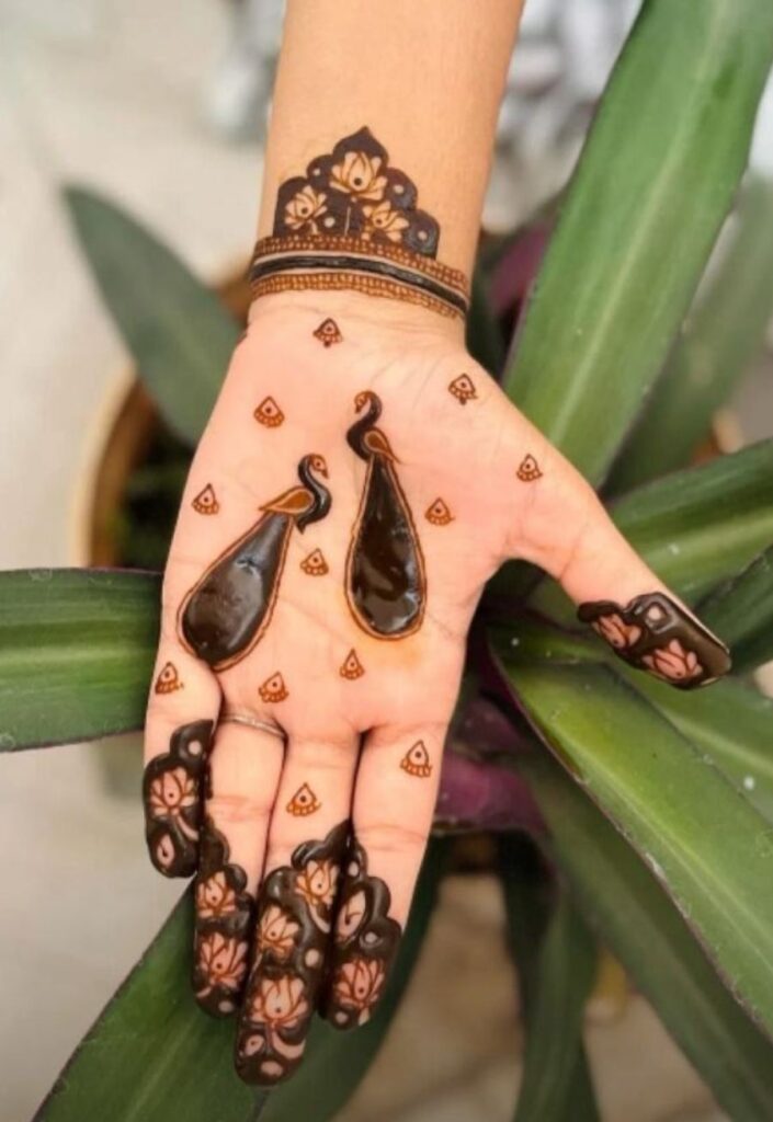 Peacock and lotus fusion mehndi design 2026 with traditional bridal artwork and detailed floral feather pattern