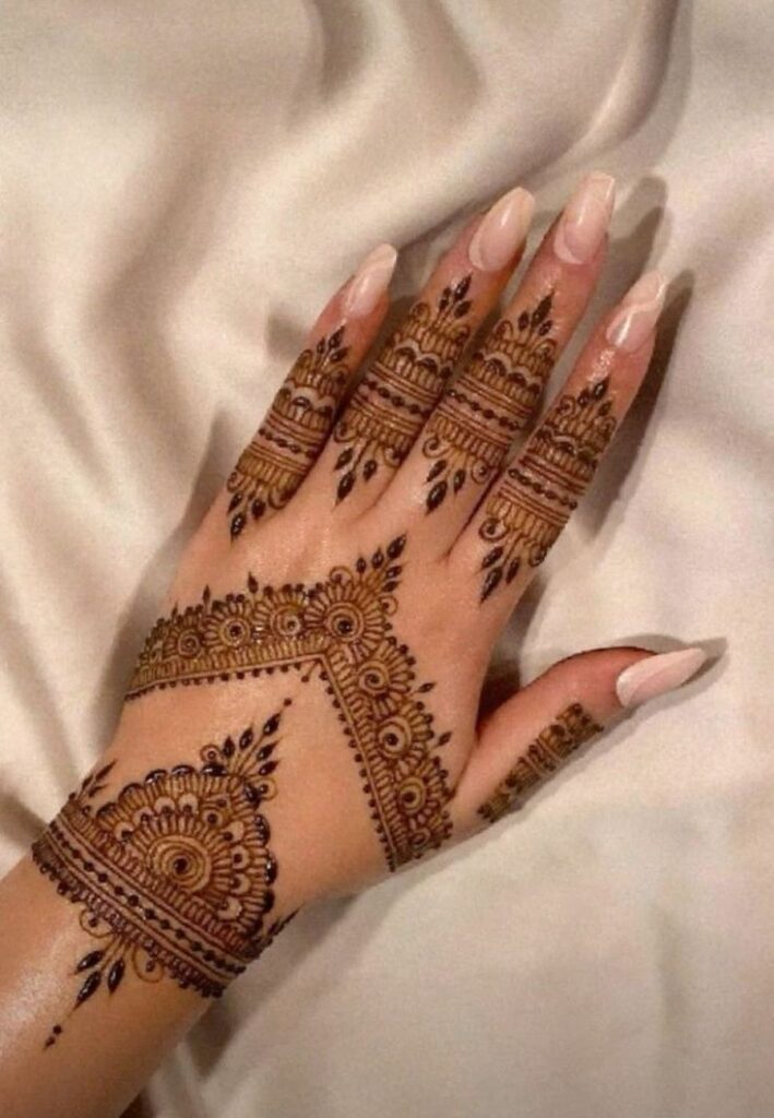 Royal V-shaped Dubai Mehendi Design with structured wrist pattern.