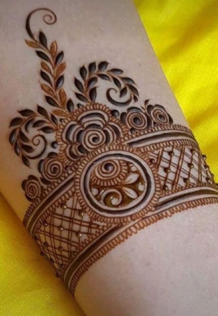 Royal wrist cuff bridal mehndi with luxurious detailed henna patterns for modern brides