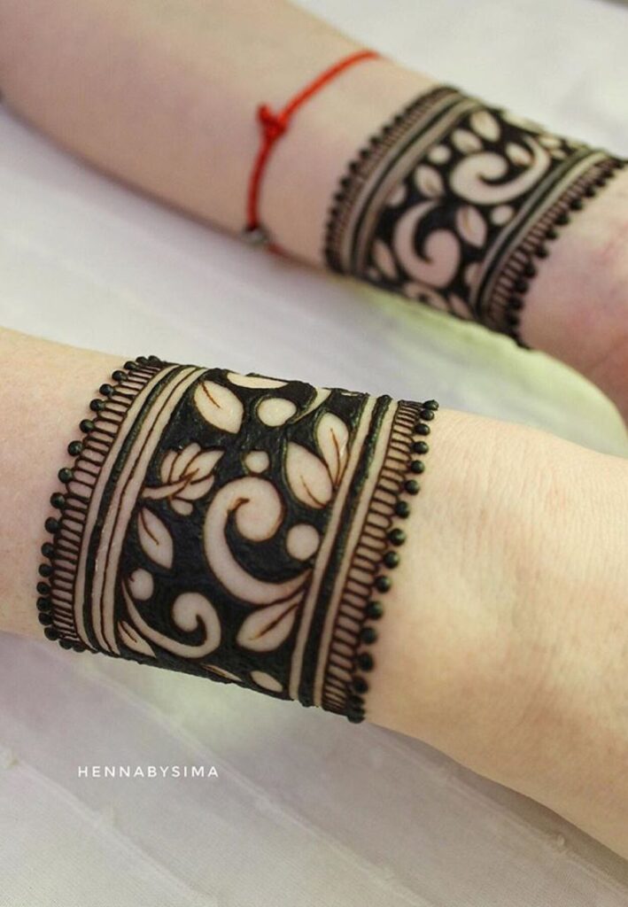 Royal wrist cuff bridal mehndi with luxurious detailed henna patterns for modern brides