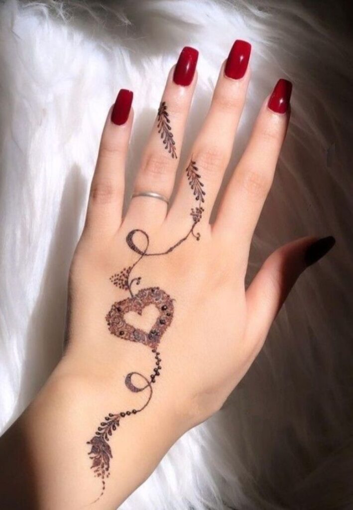 Simple heart Eid mehndi design with minimal dots and floral accents on palm