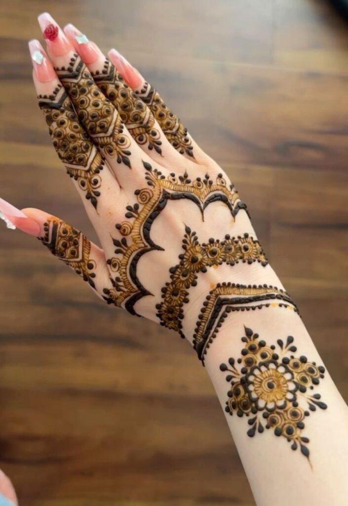 Simple mehrab mehndi design with minimal arch patterns and delicate floral lines on the hand for an elegant modern look