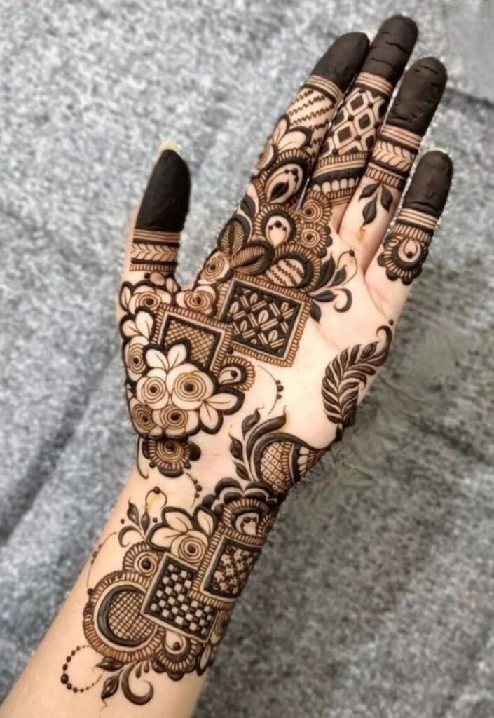 Symmetrical front hand Dubai Mehendi Design with balanced floral artistry.