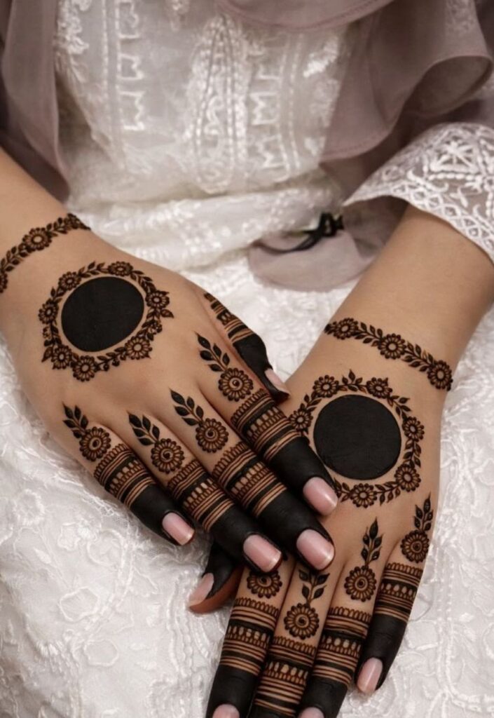 Traditional dark Pakistani mehndi design for Bakra Eid 2026 with bold outlines and full hand coverage.