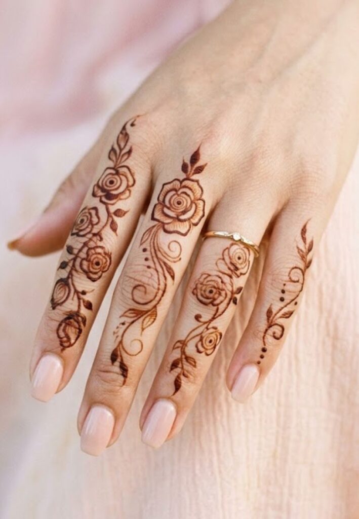 Rose finger mehndi design with detailed floral artwork