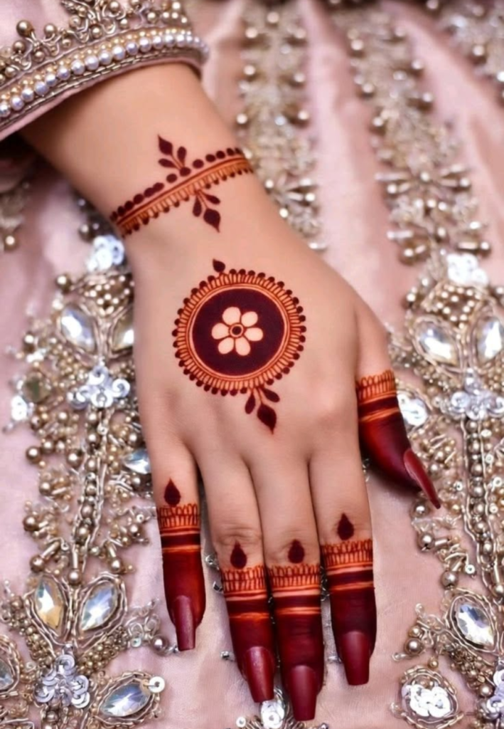 Top view of a hand decorated with modern circle (mandala-style) mehndi design featuring bold circular patterns, intricate floral detailing, and symmetrical geometric elements representing 2026 trending minimalist bridal art.