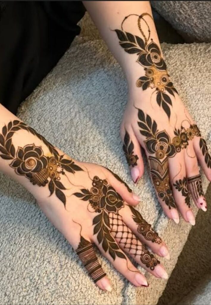 Arabic anniversary mehndi design with bold floral motifs, flowing vines, and stylish henna artwork.