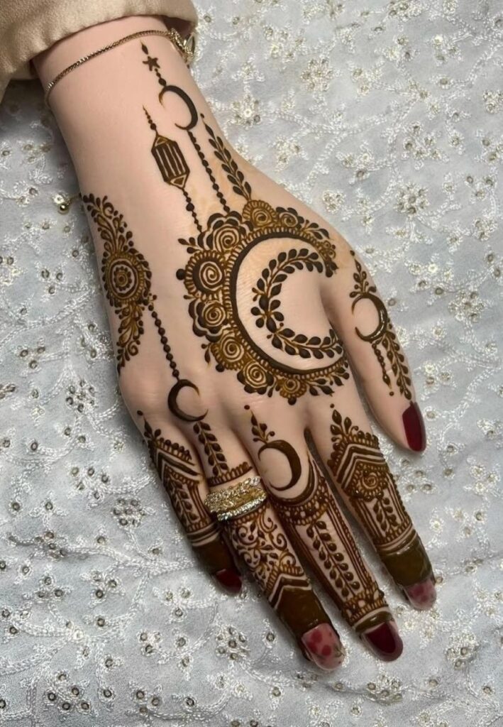 Back hand Rabi al-Awwal Mehndi Design 2026 with floral bracelet henna pattern