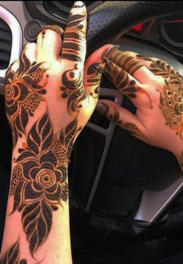 Beautiful negative space in Gulf Style Floral Henna design with clean gaps between bold floral motifs and elegant Arabic mehndi patterns on hands