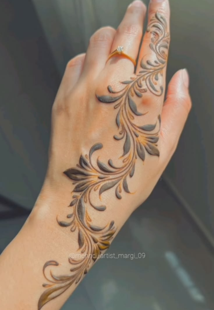 Celebrity inspired mehndi trends 2026 showing stylish half-hand henna designs with modern floral and geometric patterns, influenced by red carpet and bridal celebrity looks with elegant minimal detailing.