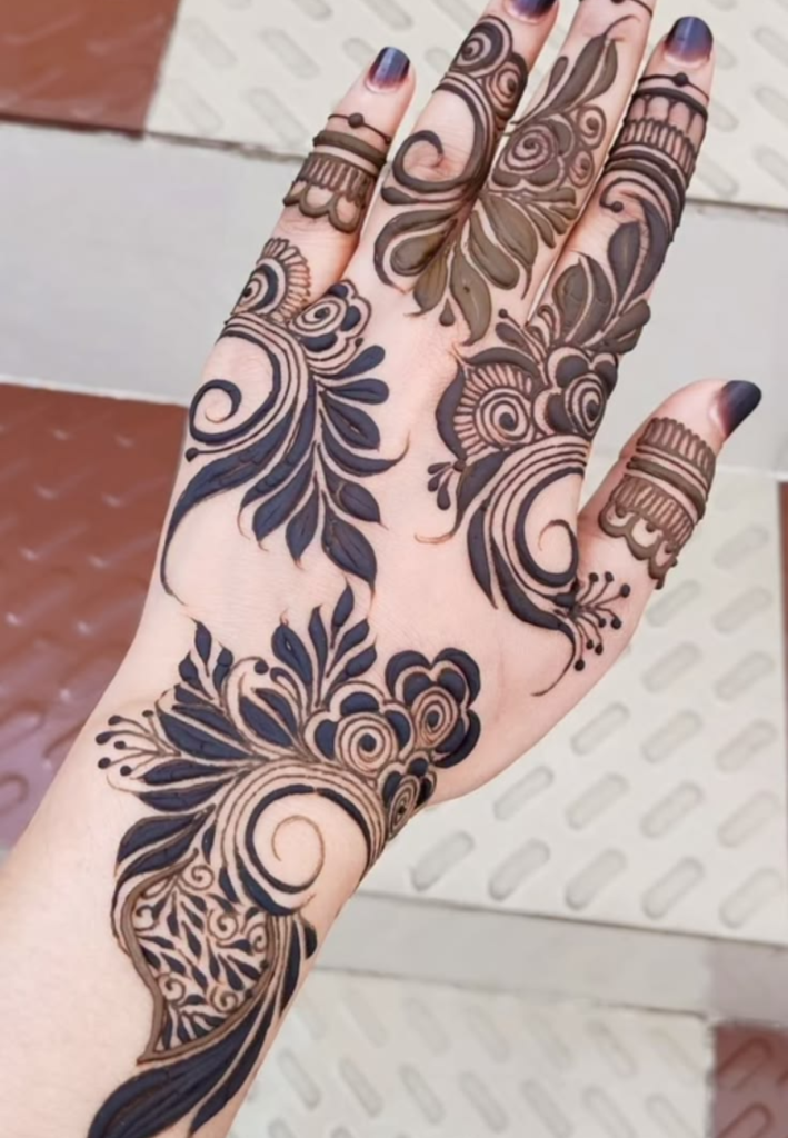 Diagonal floral vine Gulf Style Henna design with bold flowers arranged in a slanted pattern, connected with elegant flowing Arabic mehndi vines on hand