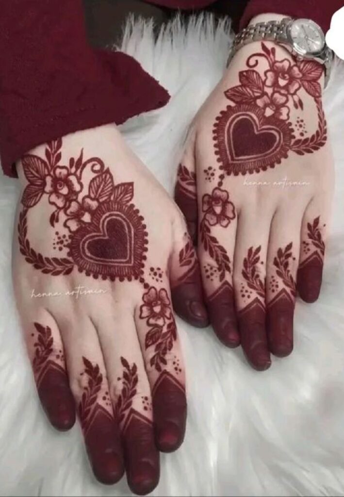 Heart-themed anniversary mehndi design with romantic love motifs and elegant floral patterns.