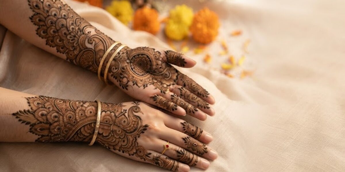 Elegant Peacock Mehndi Designs featuring intricate peacock feathers, floral patterns, and bridal henna artwork on hands