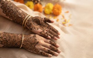 Elegant Peacock Mehndi Designs featuring intricate peacock feathers, floral patterns, and bridal henna artwork on hands