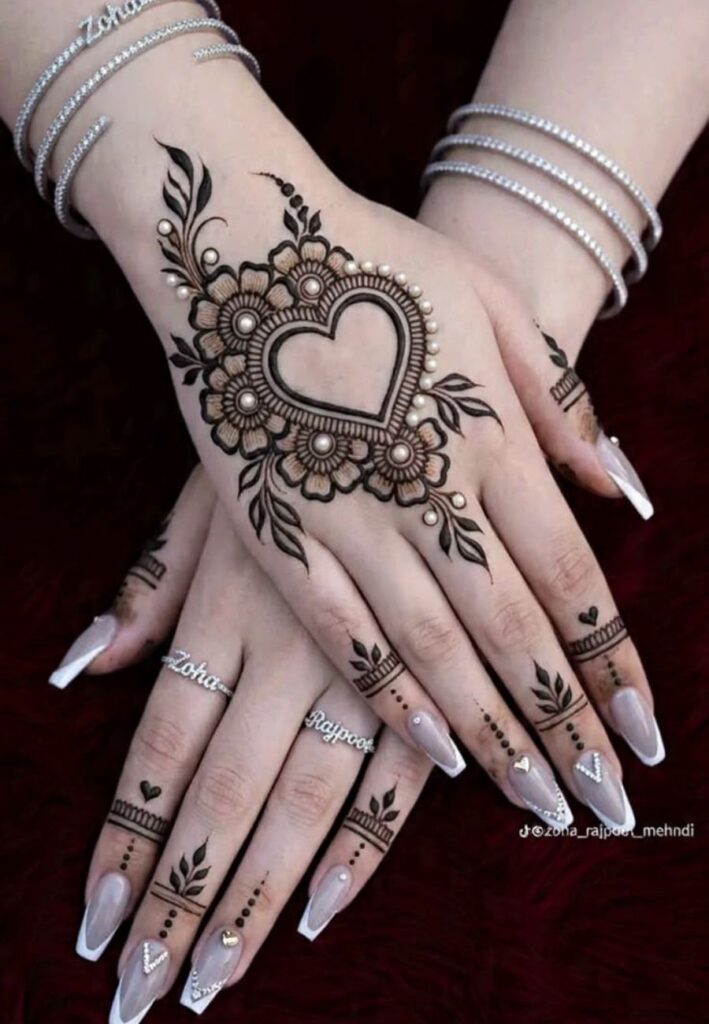 Cute heart mehndi design on female hand