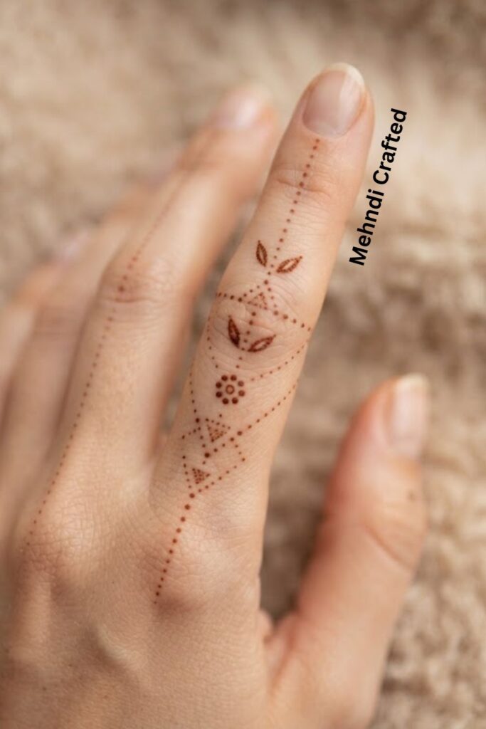 Dotted Finger Henna Tattoo Design with delicate dots and minimal henna details