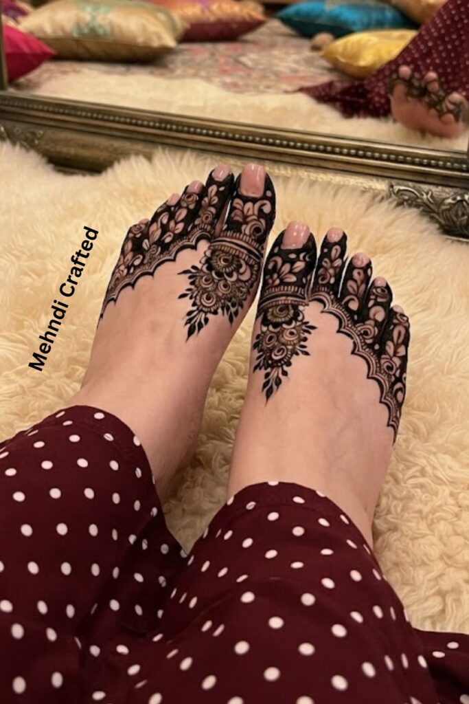 Finger-inspired minimal foot mehndi pattern with dots and leaves