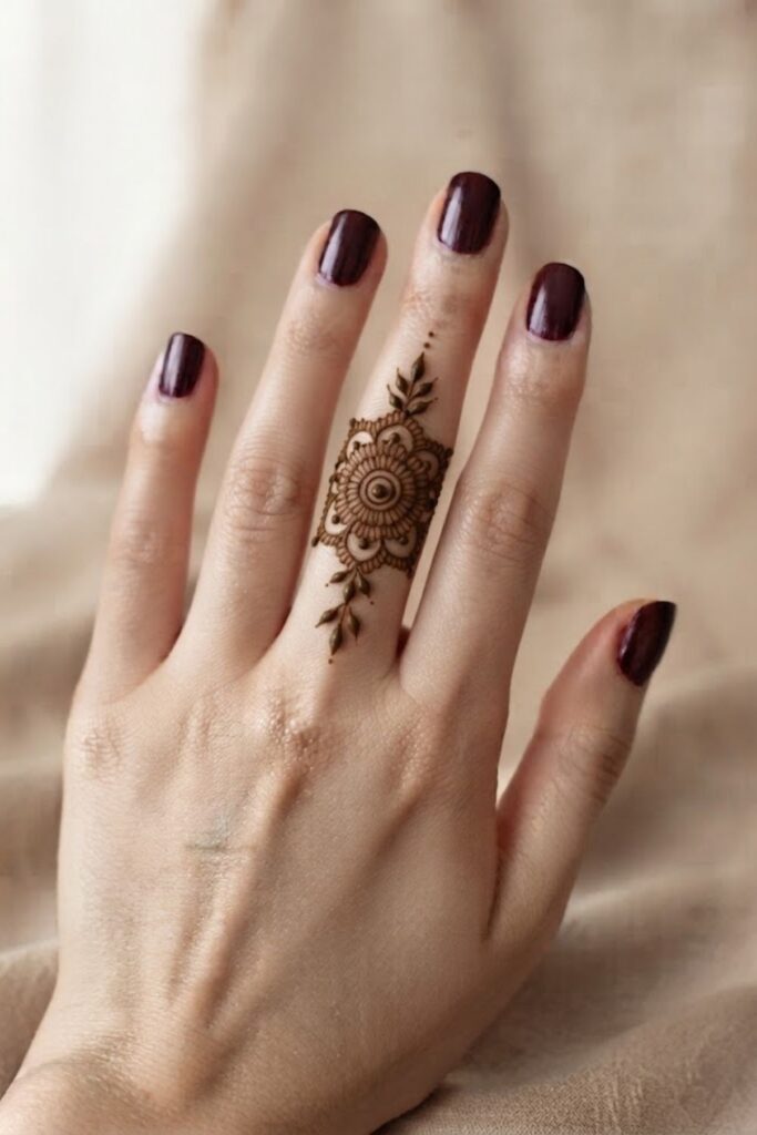 Mandala finger mehndi design with delicate floral petals and fine henna details