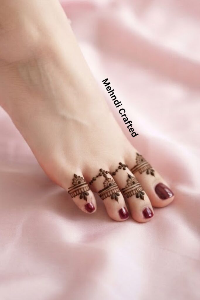 Minimal toe ring mehndi design with delicate floral details